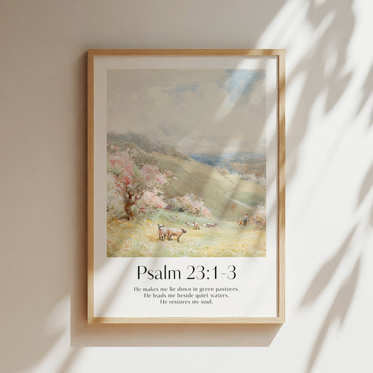 A framed Christian Print on a wall with sheep landscape and the bible verse Psalm 23