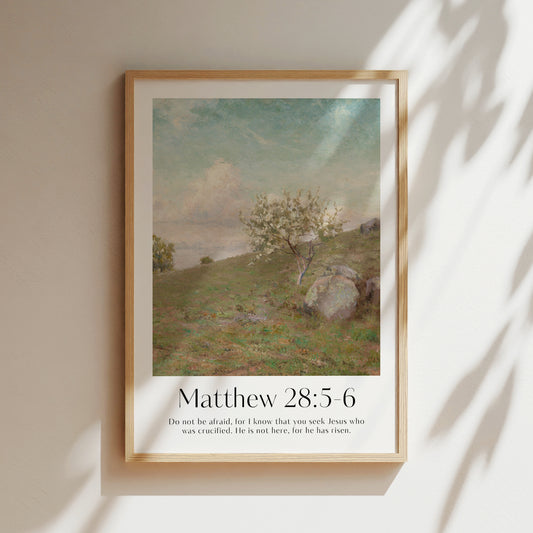 A framed Christian Print in the hallway with a vintage landscape and the bible verse Matthew 28 5 6