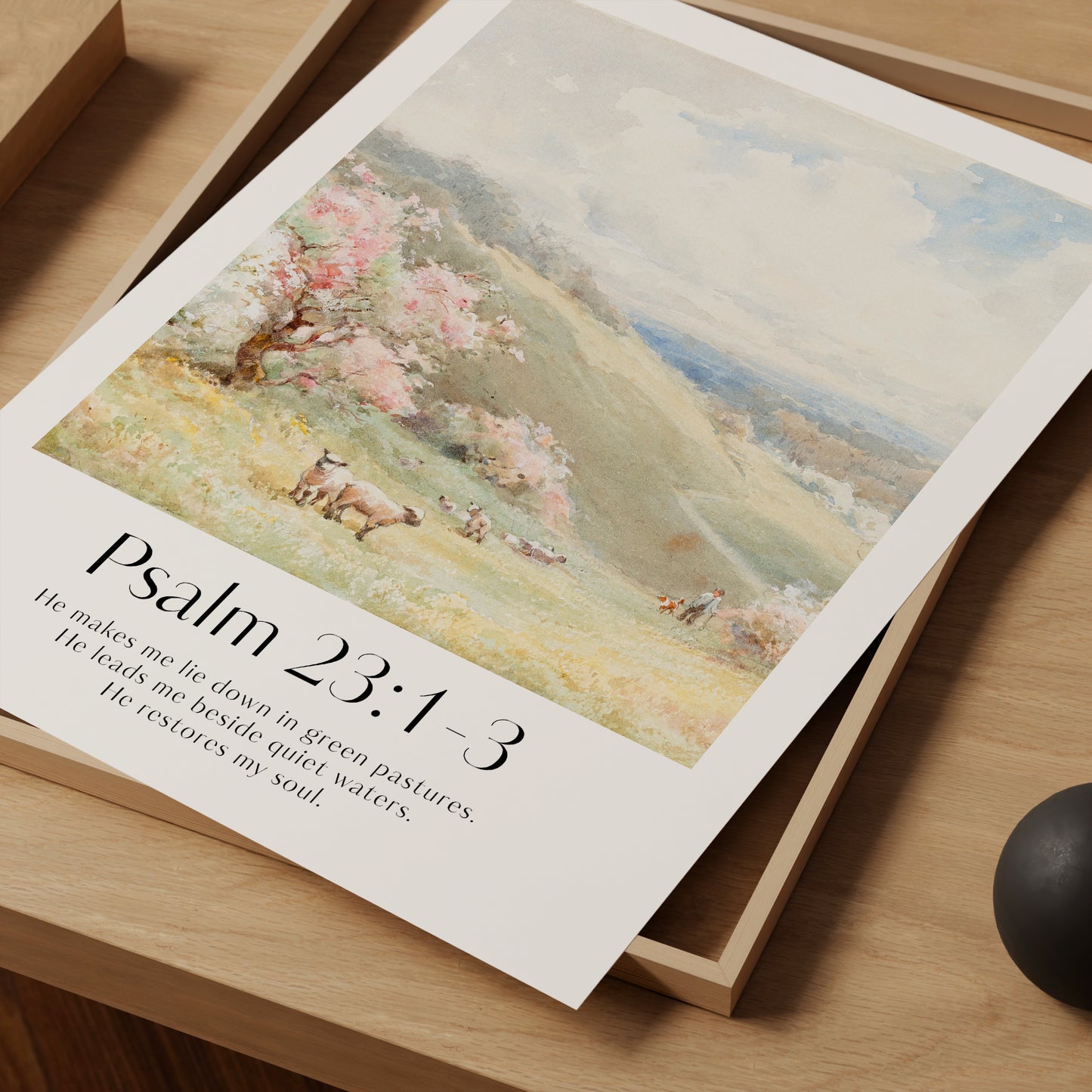 A close up framed Christian Print with sheep landscape and the bible verse Psalm 23