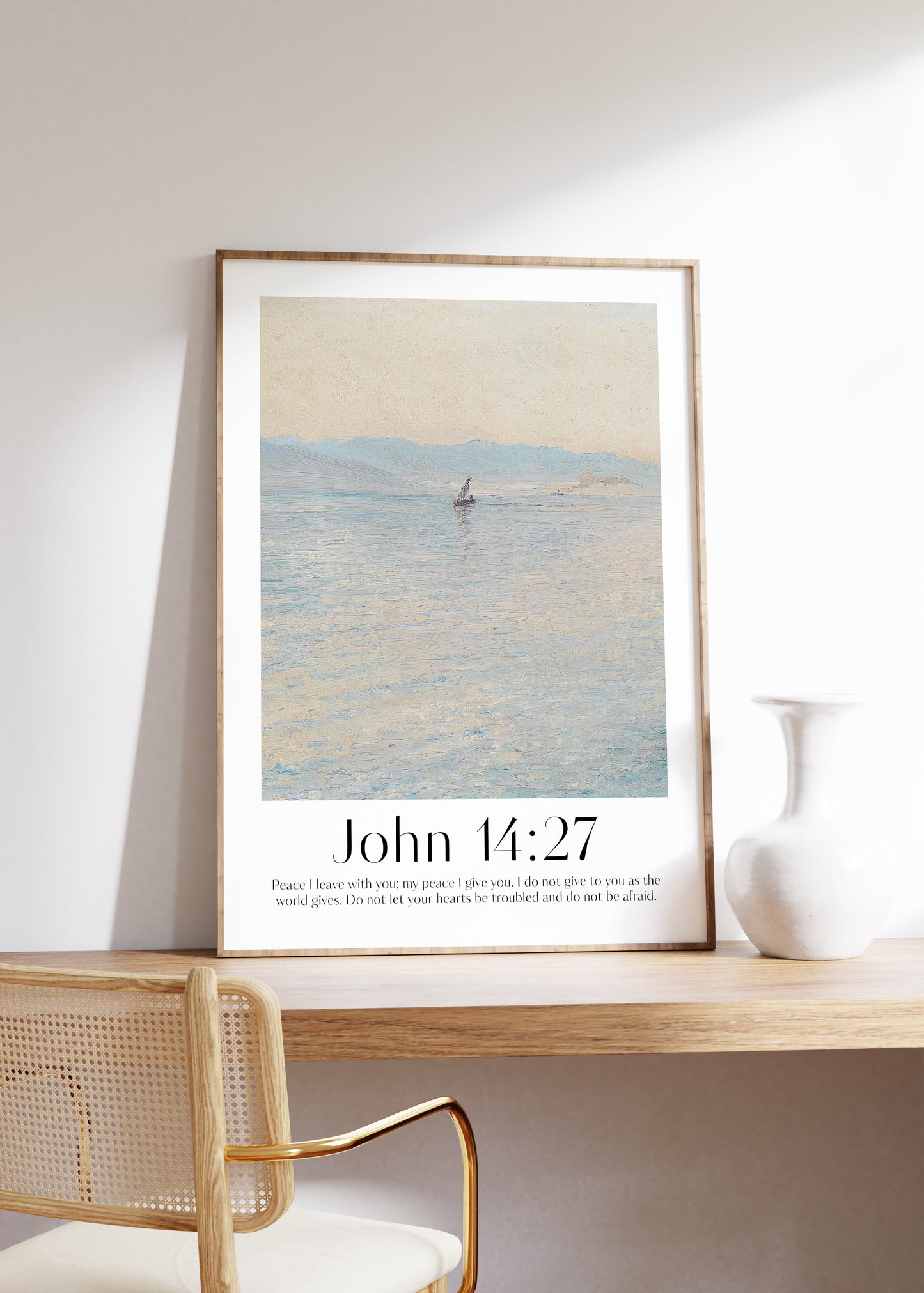 Framed Christian wall art print featuring a serene seascape inspired by Menci Clement. Displays the Bible verse John 14:27: "Peace I leave with you; my peace I give you. I do not give to you as the world gives. Do not let your hearts be troubled and do not be afraid." This artwork combines a peaceful ocean scene with comforting scripture, making it a tranquil addition to any Christian home. Elegantly framed in light wood, perfect for enhancing bedroom or prayer space decor.