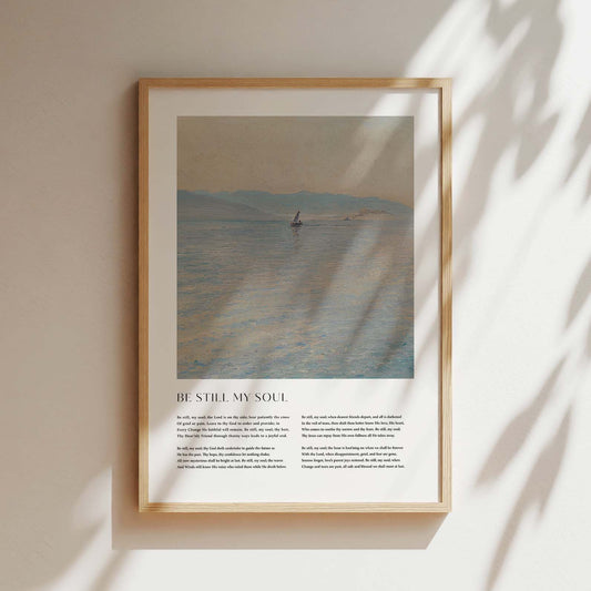 Framed Christian wall art print featuring a serene seascape in a vintage style. The artwork is paired with the comforting lyrics of the hymn "Be Still My Soul," offering words of peace and faith. This piece combines calming scenery with spiritual reflection, making it an ideal addition to any home or prayer space.