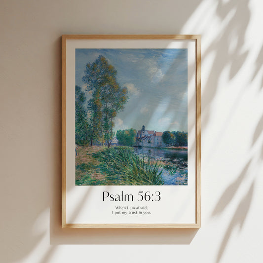 Framed Christian wall art print featuring a vintage-style landscape scene inspired by Alfred Sisley. The artwork showcases a serene riverside with a church in the background, paired with the Bible verse Psalm 56:3: "When I am afraid, I put my trust in you." This calming imagery, combined with the comforting scripture, makes it an ideal piece for creating a peaceful atmosphere in any home or prayer space.