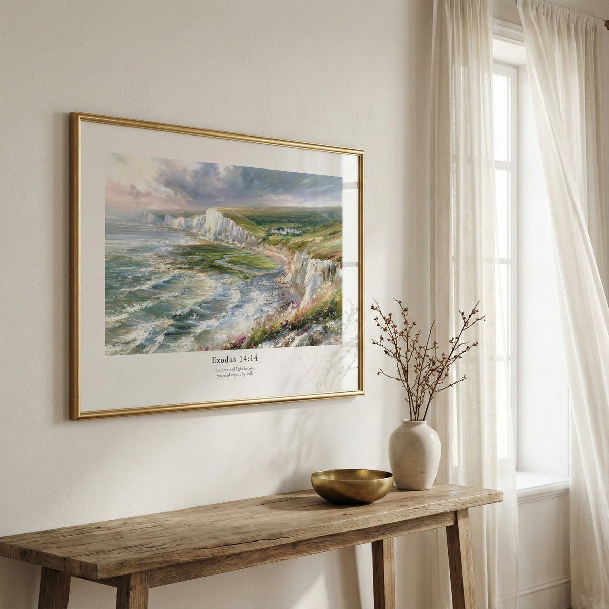 Framed scripture wall art with Exodus 14:14 and a dramatic coastal landscape, displayed above a rustic wooden bench.