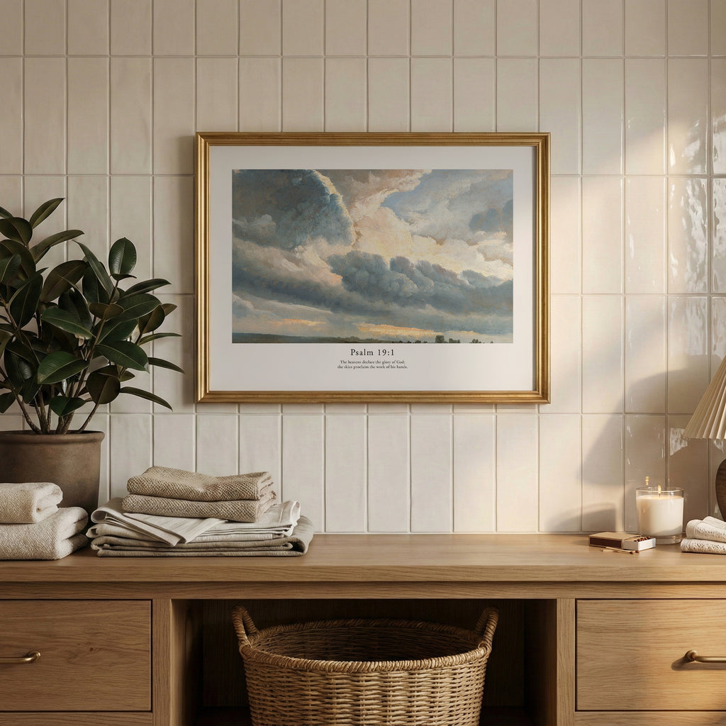 Psalm 19:1 Christian wall art featuring a luminous dramatic sky, framed above a wooden cabinet in a neutral interior.