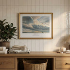 Psalm 19:1 Christian wall art featuring a luminous dramatic sky, framed above a wooden cabinet in a neutral interior.
