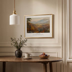 Isaiah 41:10 Bible verse wall art featuring a peaceful mountain scene, framed above a dining table in a neutral interior.