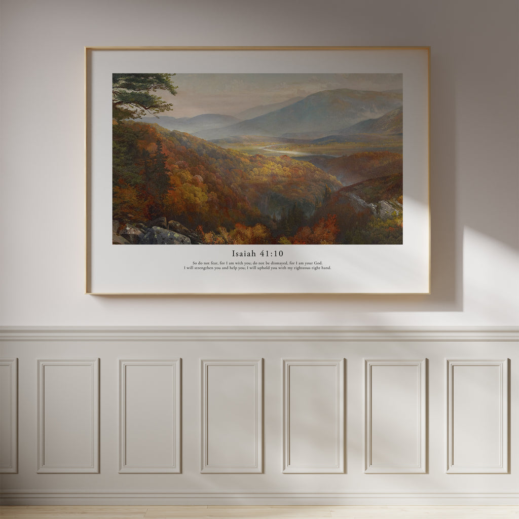 Isaiah 41:10 Christian wall art featuring a peaceful mountain valley landscape, framed on a white panelled wall.