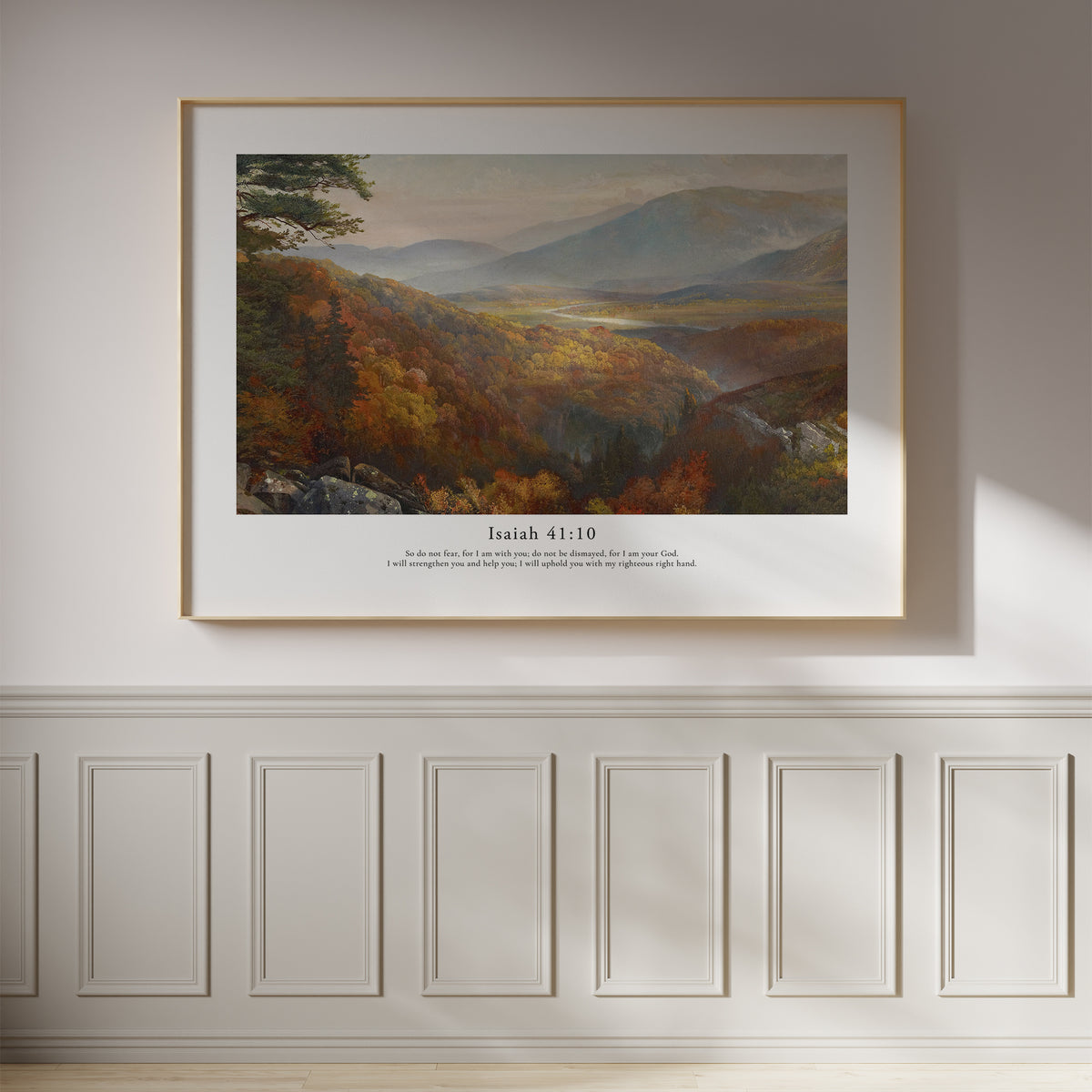 Isaiah 41:10 Christian wall art featuring a peaceful mountain valley landscape, framed on a white panelled wall.