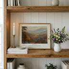 Christian wall art featuring Isaiah 41:10 and a warm autumn valley, styled on a wooden shelf with flowers and candles.
