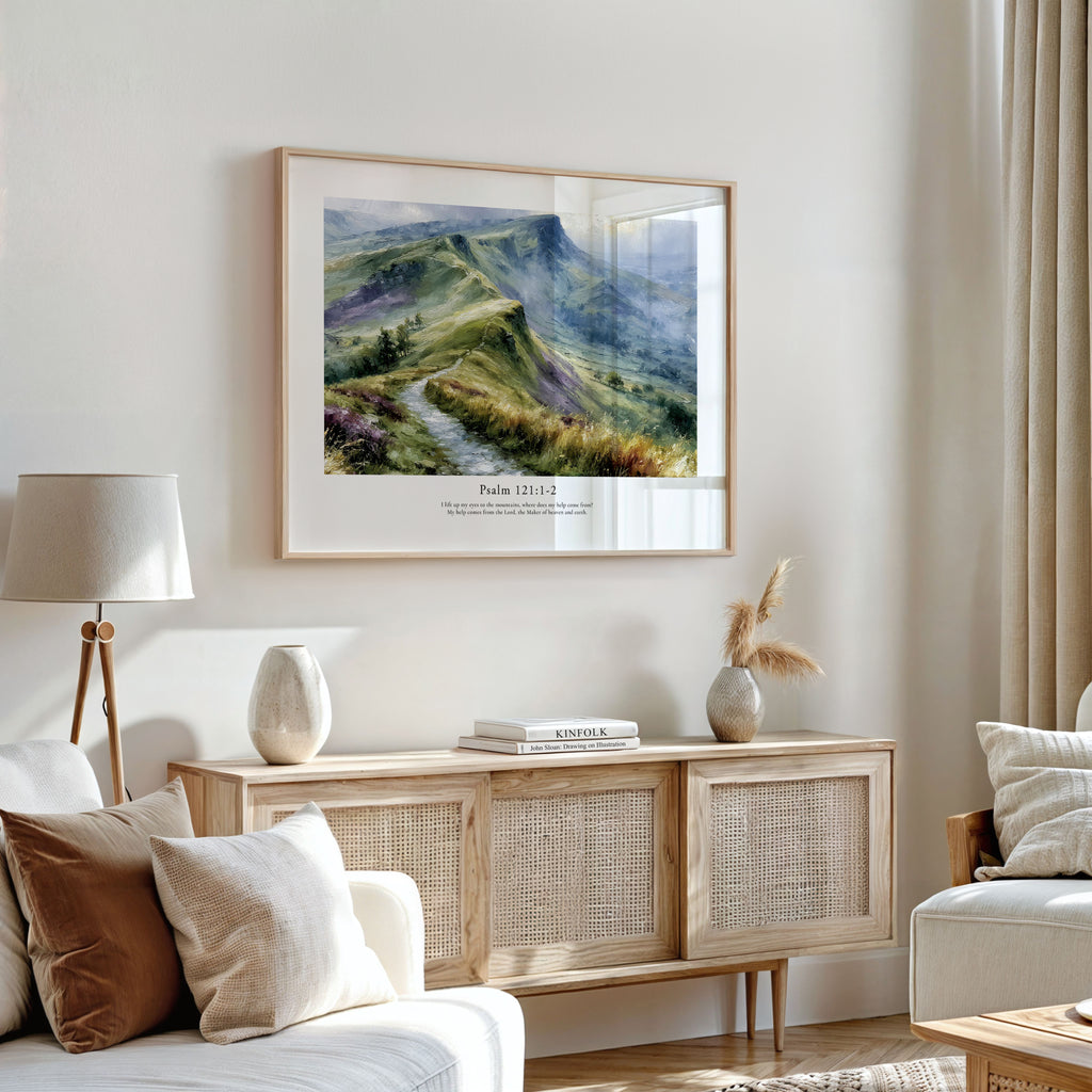 Psalm 121:1–2 Bible verse wall art featuring a serene green mountain scene in a bright neutral living room.