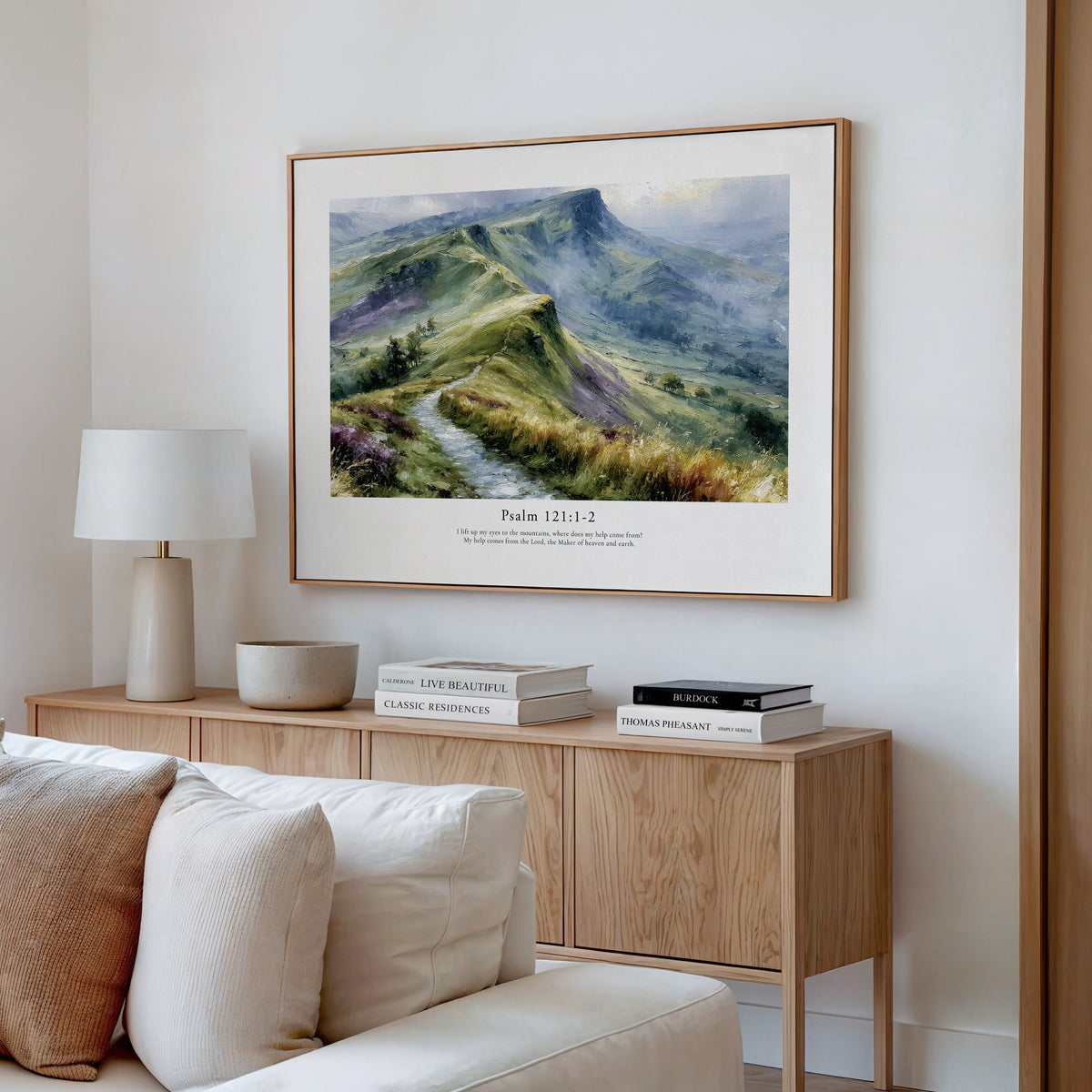 Framed scripture wall art with Psalm 121:1–2 and a peaceful mountain landscape, styled above a wooden console.