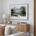 Psalm 46:10 Bible verse wall art featuring mountains reflected in a peaceful lake, styled above a wooden console.