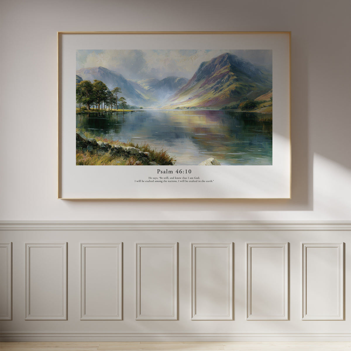 Psalm 46:10 Christian wall art featuring a peaceful mountain lake landscape, framed on a white panelled wall.