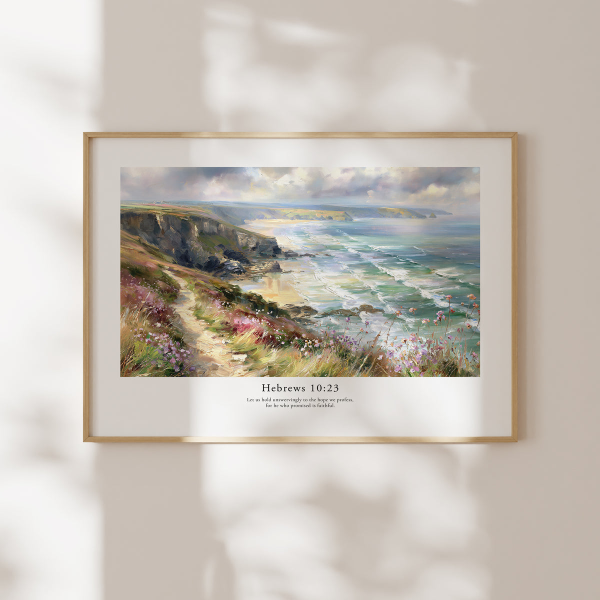 Framed Hebrews 10:23 Bible verse wall art with a windswept coastal scene and soft natural window shadows.