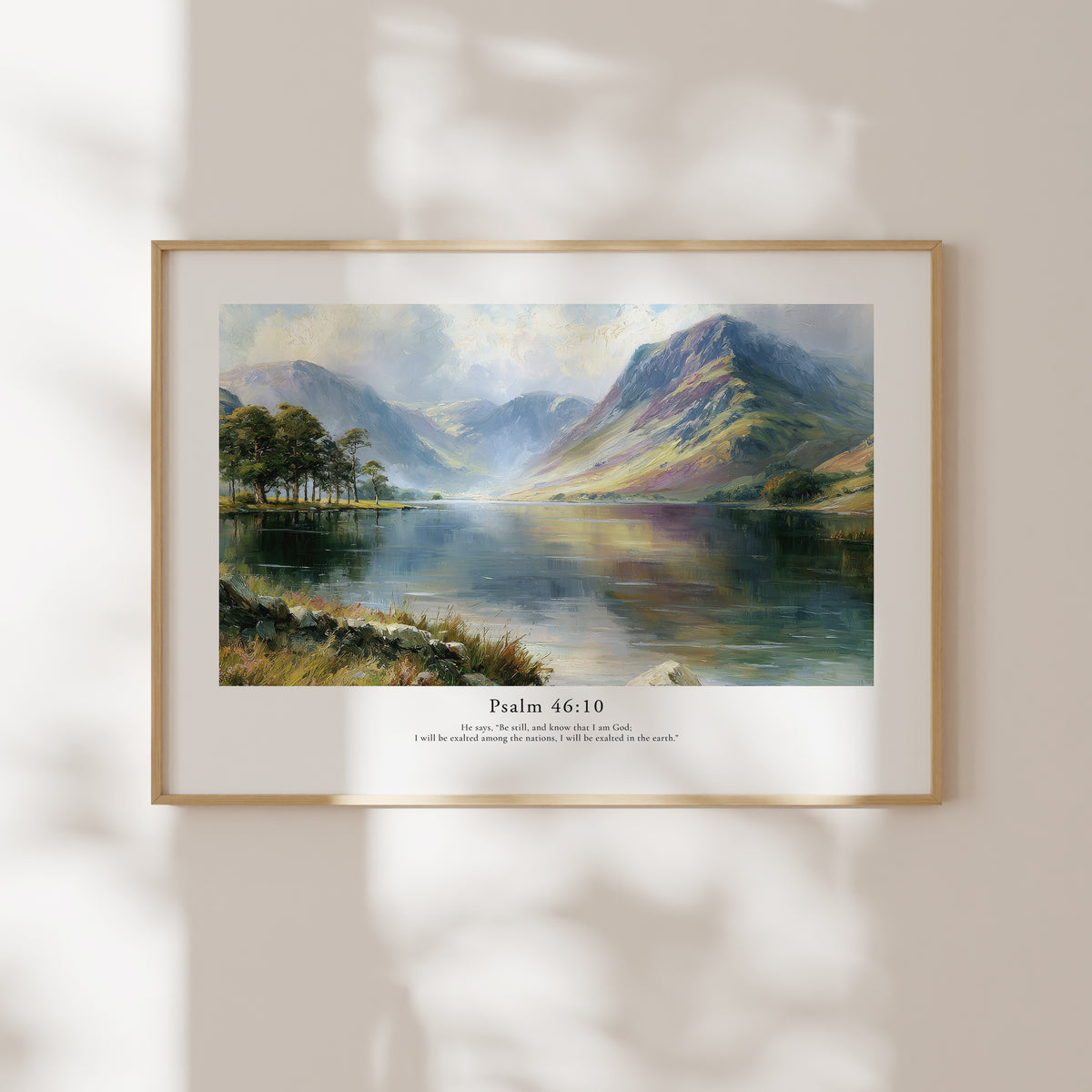 Framed Psalm 46:10 Bible verse wall art with a serene mountain and lake scene in soft natural window light.