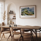 Psalm 121:1–2 Christian art print featuring rolling green hills, displayed in a warm neutral dining room.