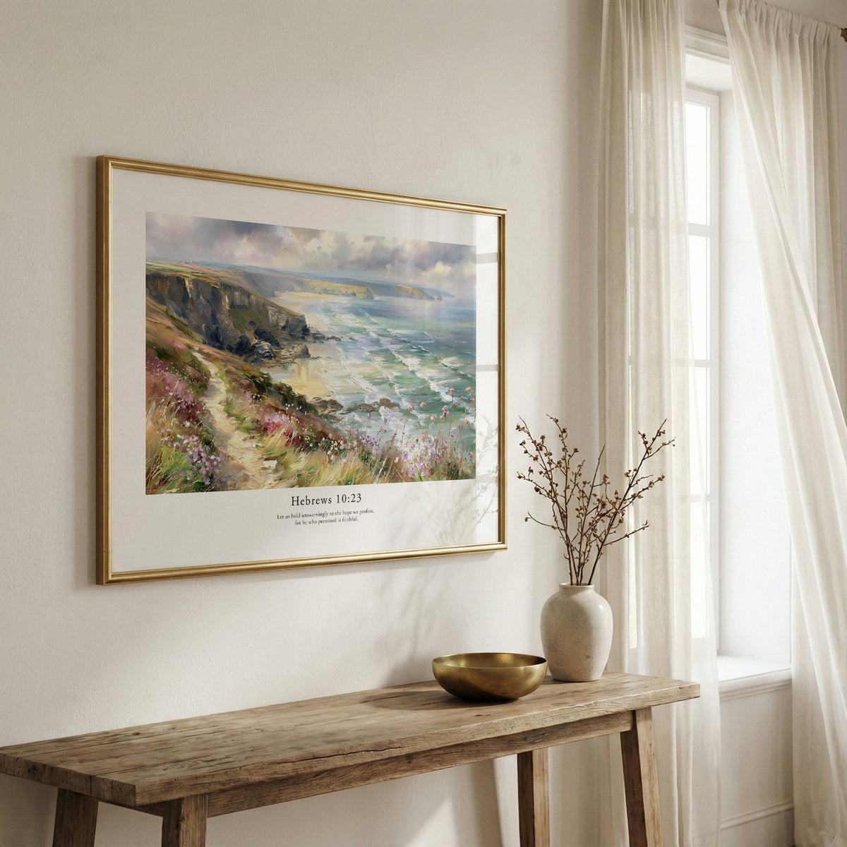Framed scripture wall art with Hebrews 10:23 and a dramatic coastal scene, displayed above a rustic wooden bench.