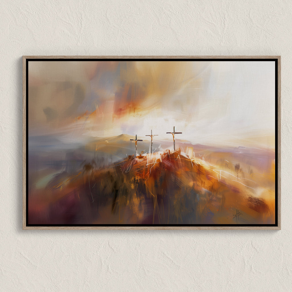 Framed artwork of three crosses on a mountain with a colorful sky.