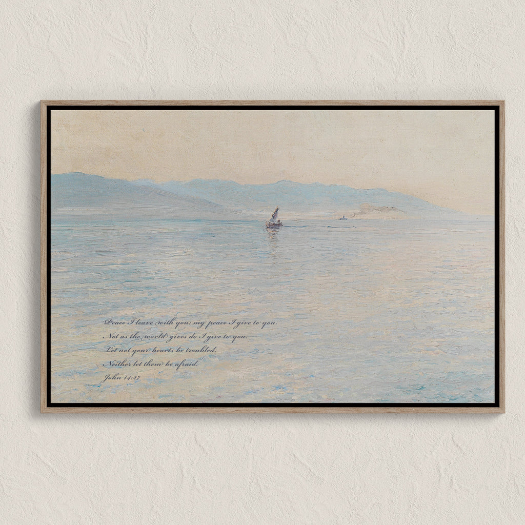 Framed artwork of a sailboat on water with text on a beige wall.