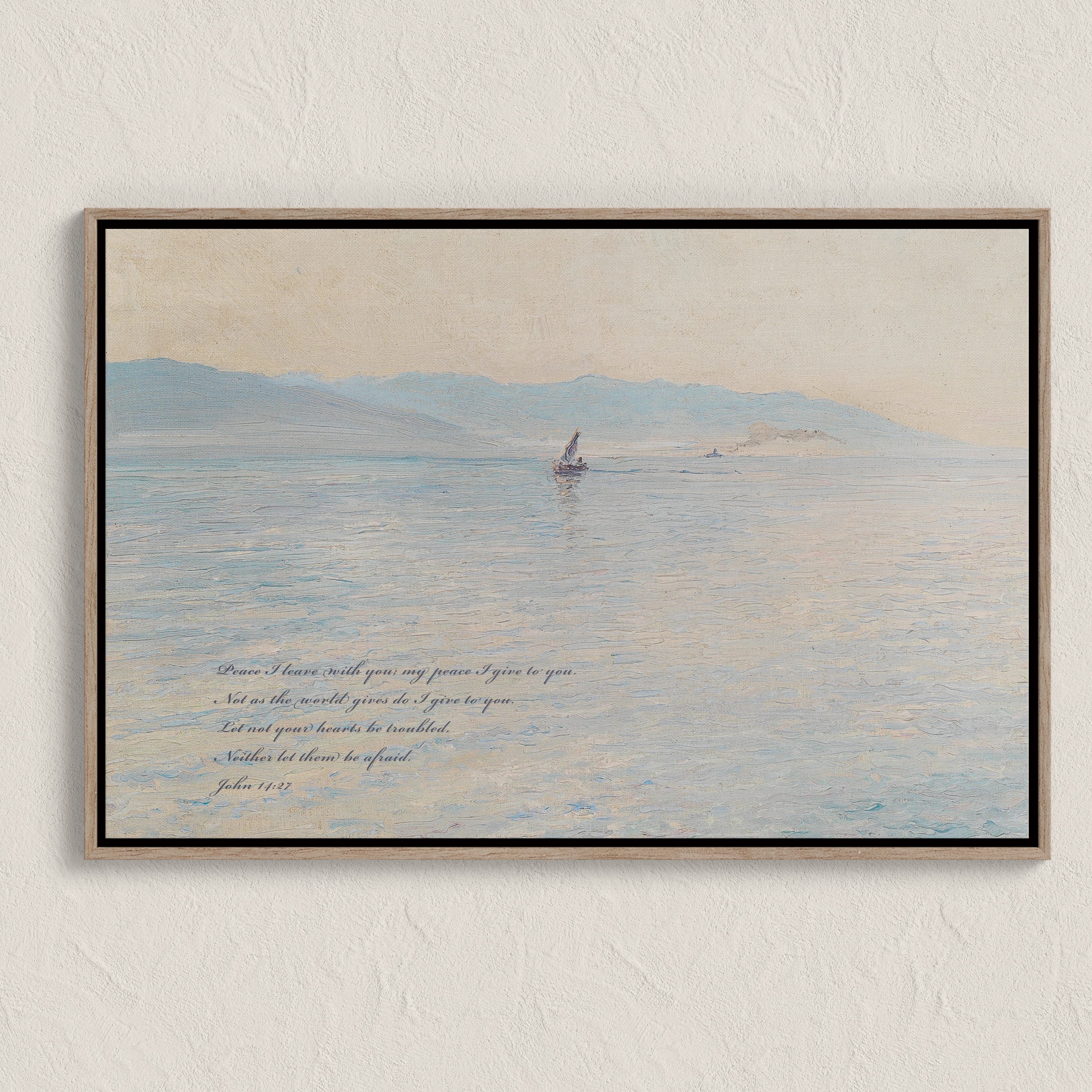 Framed artwork of a sailboat on water with text on a beige wall.