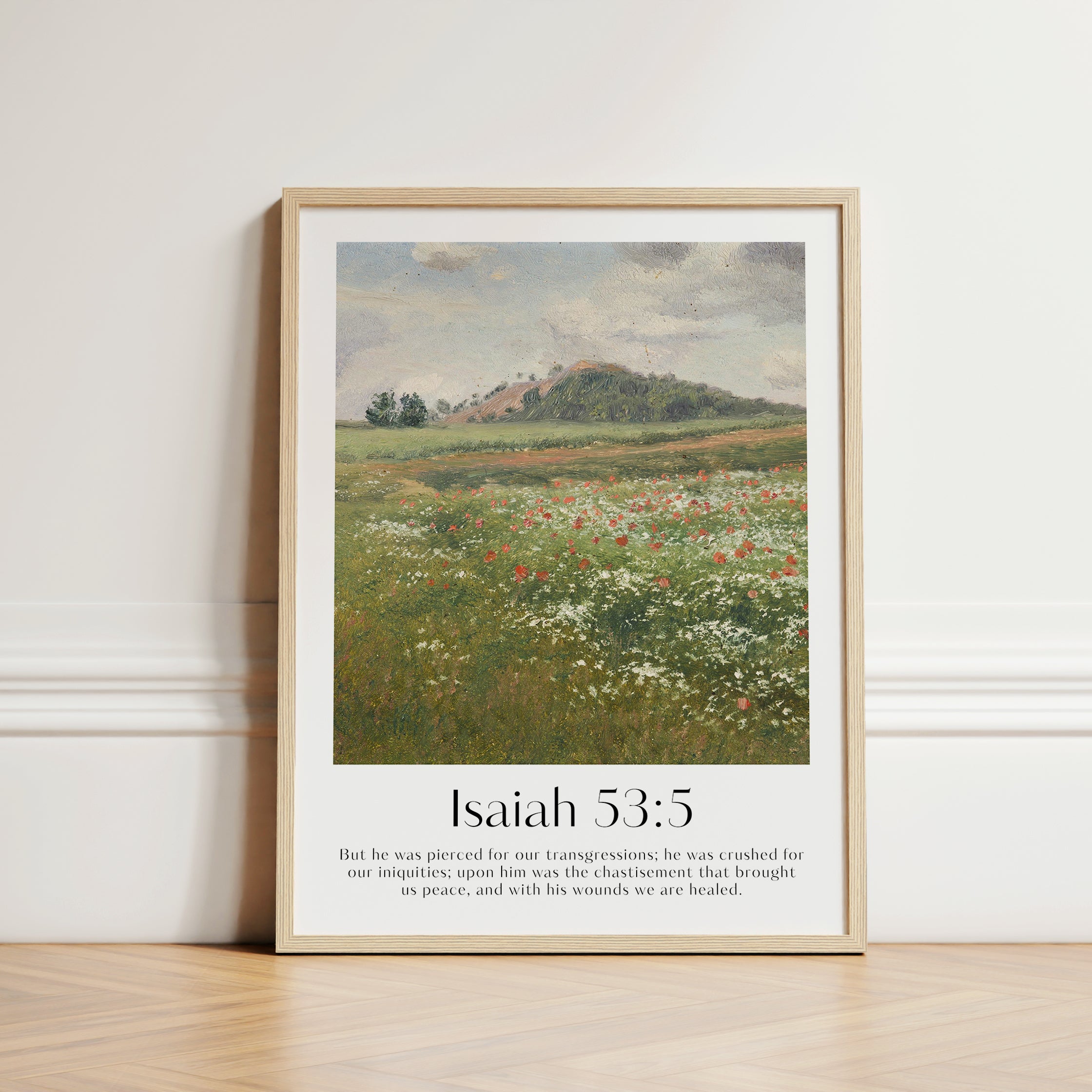A large framed Christian Print in the hall with a vintage landscape and the bible verse Isaiah 53:5