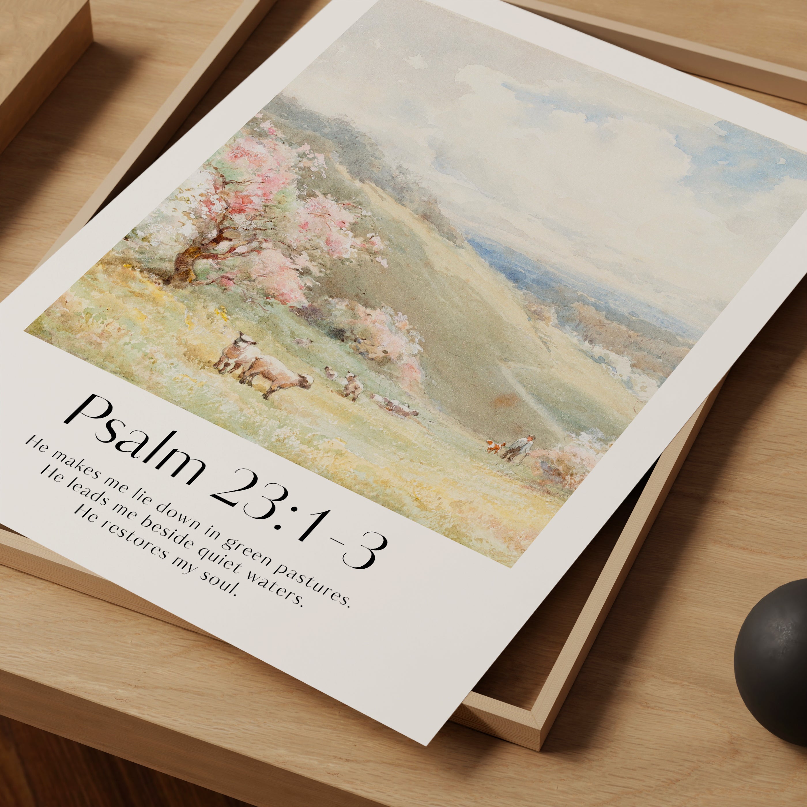 A close up framed Christian Print with sheep landscape and the bible verse Psalm 23