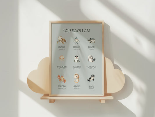 Framed children's christian print with ocean animal illustrations and affirmation bible verses on a wooden stand against a light background