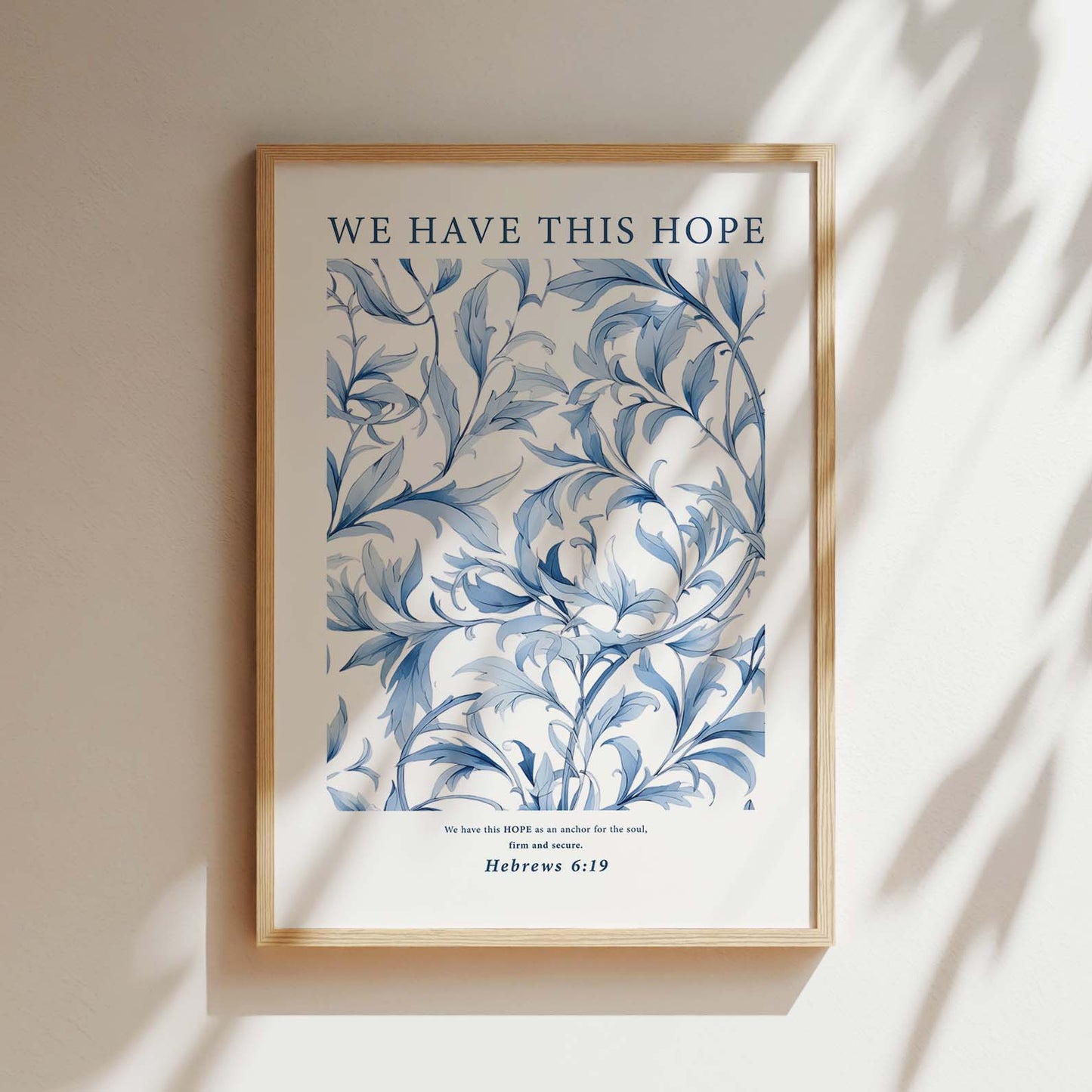 Framed Christian wall art print featuring an intricate blue botanical design. The artwork is paired with the Bible verse Hebrews 6:19: "We have this HOPE as an anchor for the soul, firm and secure." This elegant print offers a peaceful reminder of faith and hope, perfect for adding a calming touch to any room or meditation space.