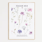 Framed Christian wall art print featuring a delicate botanical design with pastel purple and pink flowers. The artwork is paired with the Bible verse Isaiah 40:8: "The grass withers and the flowers fall, but the word of our God endures forever." This floral piece combines nature’s beauty with spiritual wisdom, making it a perfect addition to any home or peaceful space.