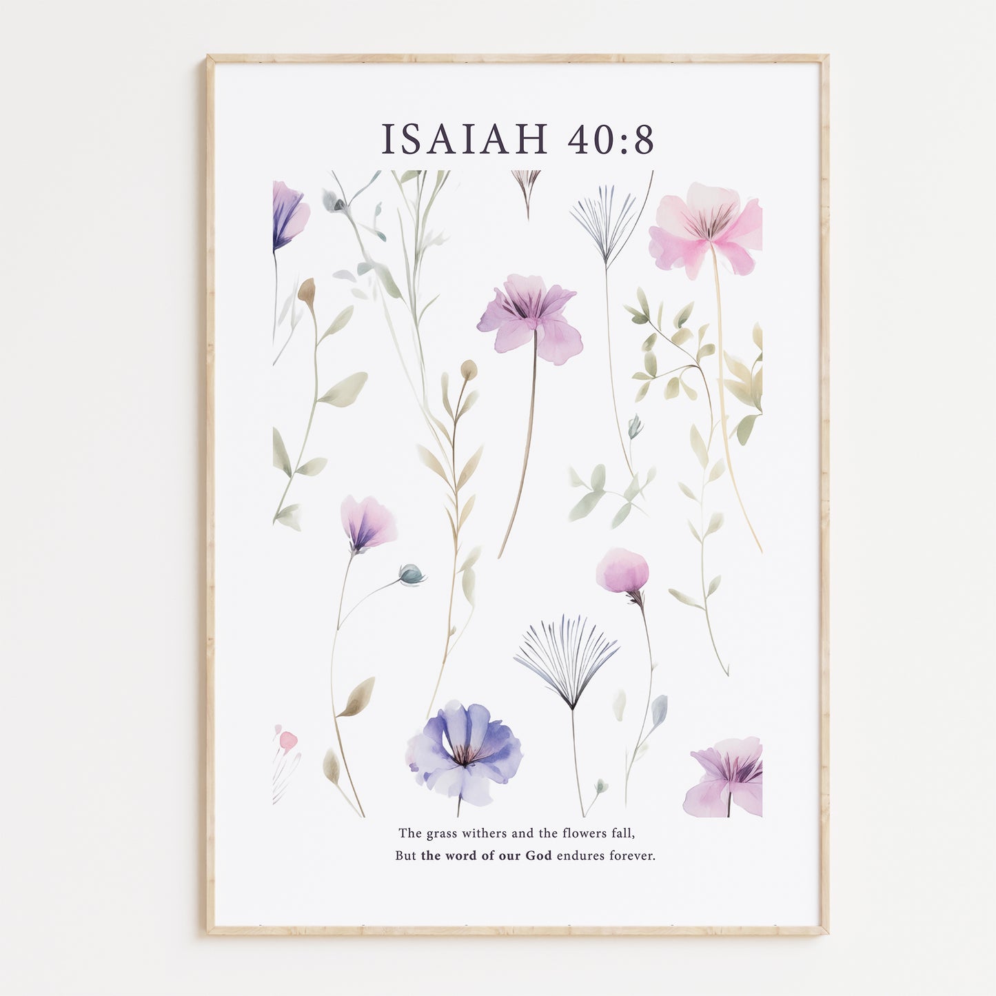 Framed Christian wall art print featuring a delicate botanical design with pastel purple and pink flowers. The artwork is paired with the Bible verse Isaiah 40:8: "The grass withers and the flowers fall, but the word of our God endures forever." This floral piece combines nature’s beauty with spiritual wisdom, making it a perfect addition to any home or peaceful space.