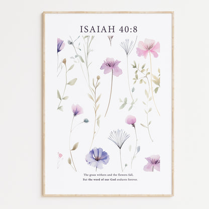 Framed Christian wall art print featuring a delicate botanical design with pastel purple and pink flowers. The artwork is paired with the Bible verse Isaiah 40:8: "The grass withers and the flowers fall, but the word of our God endures forever." This floral piece combines nature’s beauty with spiritual wisdom, making it a perfect addition to any home or peaceful space.