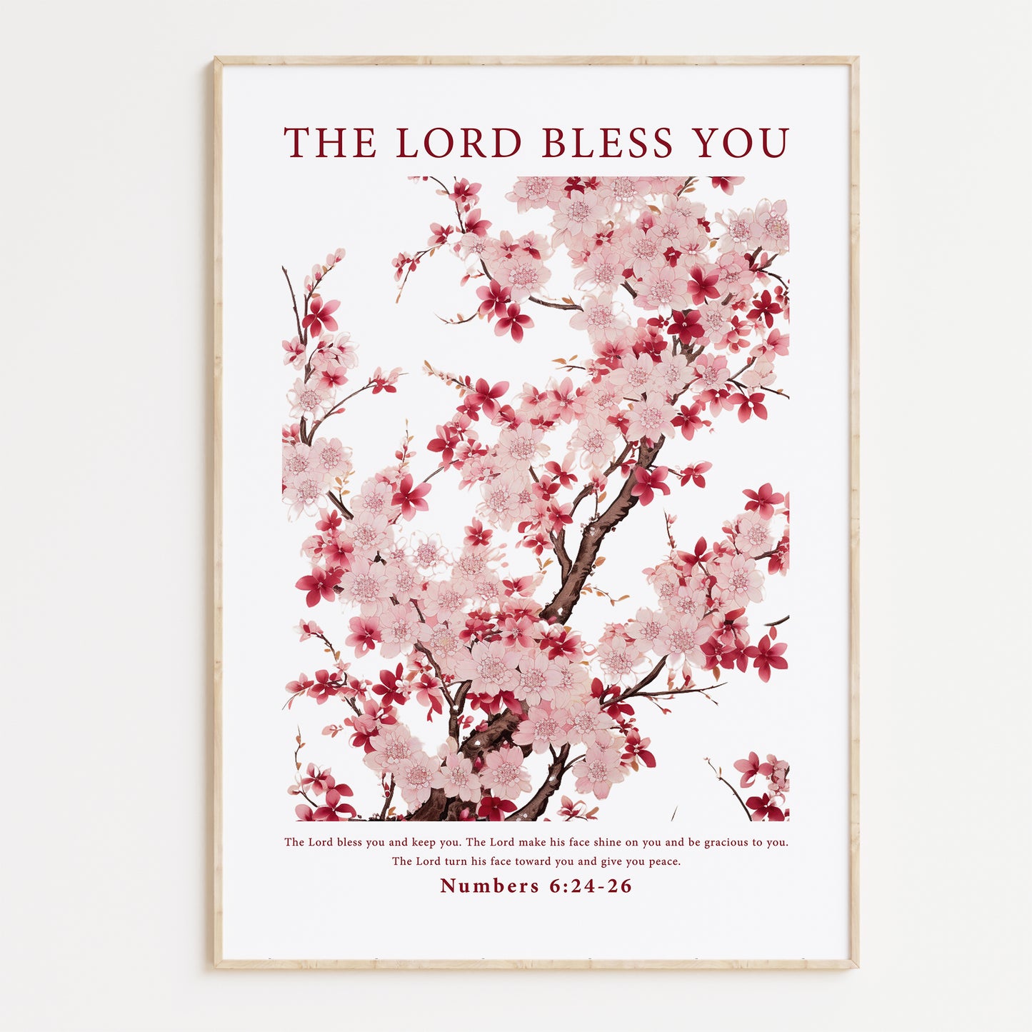 Framed Christian wall art print featuring a delicate cherry blossom tree with light pink and deep red flowers. The artwork is paired with the Bible verse Numbers 6:24-26: "The Lord bless you and keep you; the Lord make his face shine on you and be gracious to you; the Lord turn his face toward you and give you peace." This floral design combines natural beauty with spiritual blessing, perfect for any home or peaceful space.