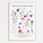 Framed Christian wall art print featuring a vibrant botanical illustration of various colorful flowers. The artwork is accompanied by the Bible verse Proverbs 3:5-6: "Trust in the Lord with all your heart and lean not on your own understanding; in all your ways submit to him, and he will make your paths straight." This piece provides a harmonious combination of floral beauty and spiritual encouragement, perfect for any home or prayer space.