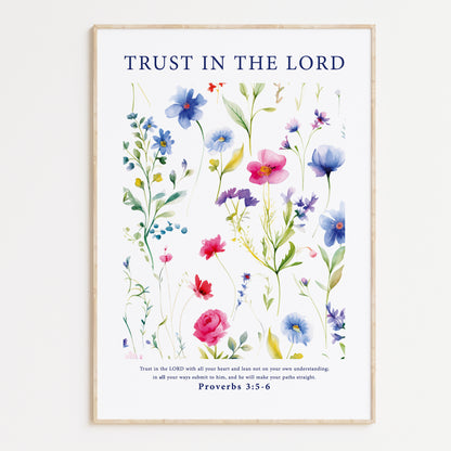 Framed Christian wall art print featuring a vibrant botanical illustration of various colorful flowers. The artwork is accompanied by the Bible verse Proverbs 3:5-6: "Trust in the Lord with all your heart and lean not on your own understanding; in all your ways submit to him, and he will make your paths straight." This piece provides a harmonious combination of floral beauty and spiritual encouragement, perfect for any home or prayer space.