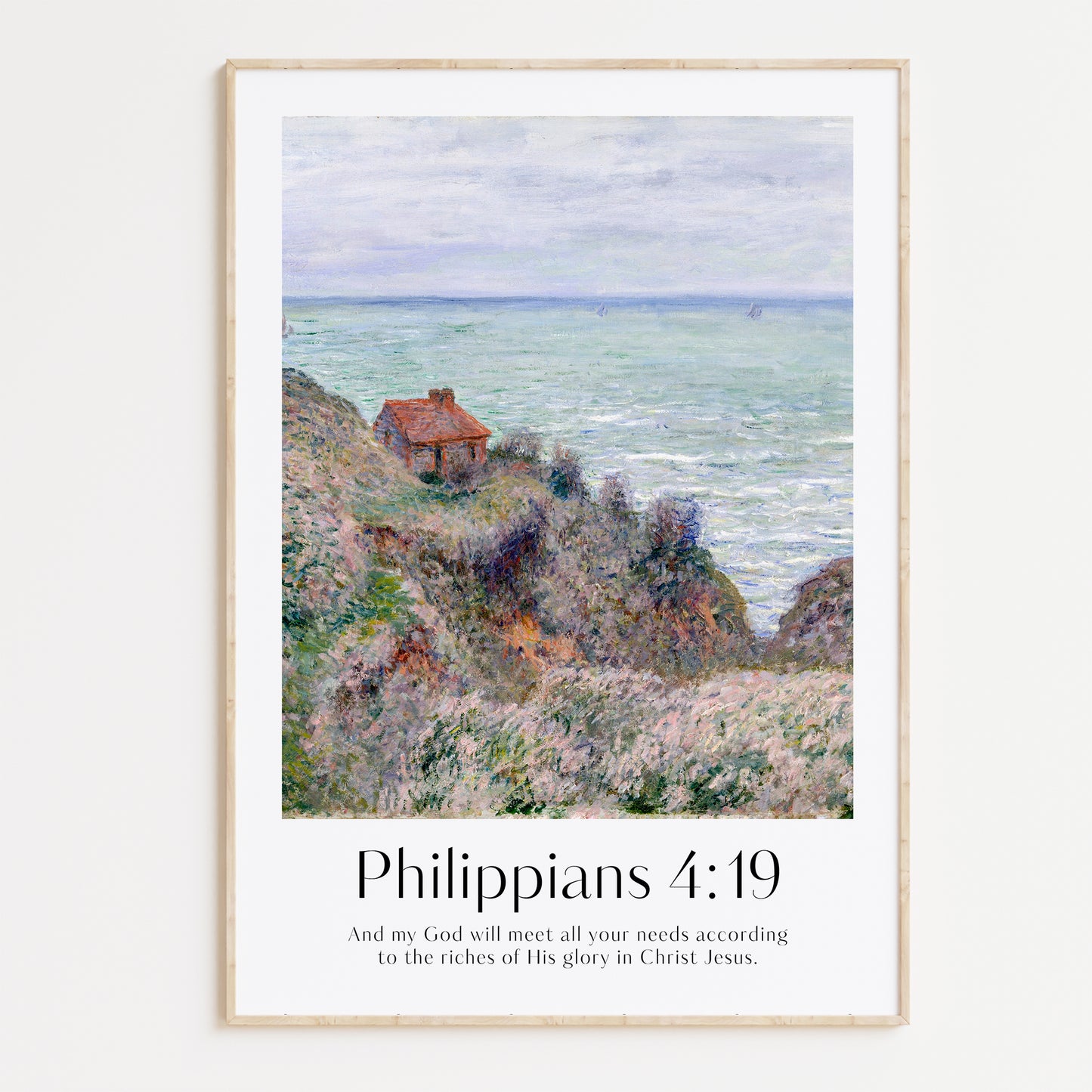 Framed Christian wall art print inspired by Claude Monet, depicting a serene coastal scene with a small cottage nestled between hills. The artwork is paired with the Bible verse Philippians 4:19: "And my God will meet all your needs according to the riches of His glory in Christ Jesus." This artwork beautifully combines the tranquility of nature with spiritual encouragement, perfect for any home.