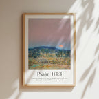 Framed Christian wall art print featuring a serene sunrise landscape inspired by Childe Hassam. Displays the Bible verse Psalm 113:3: "From the rising of the sun to the place where it sets, the name of the LORD is to be praised." This artwork combines impressionist-style scenery with uplifting scripture, making it a peaceful addition to any Christian home. Elegantly framed in light wood, perfect for enhancing living room or bedroom decor.