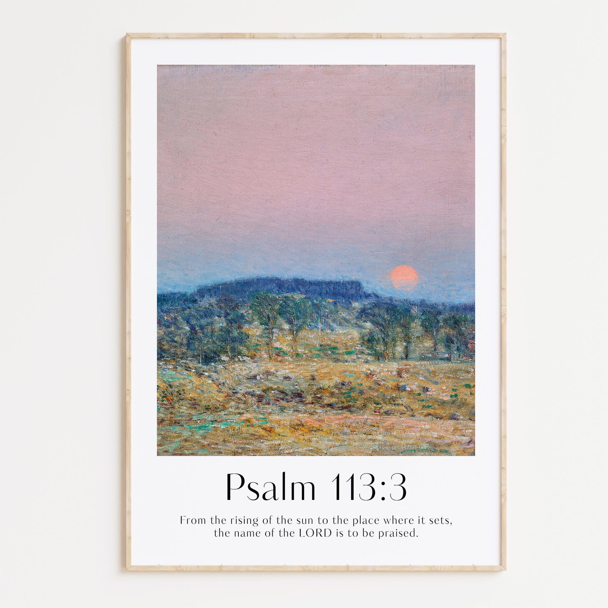 Framed Christian wall art print featuring a serene sunrise landscape inspired by Childe Hassam. Displays the Bible verse Psalm 113:3: "From the rising of the sun to the place where it sets, the name of the LORD is to be praised." This artwork combines impressionist-style scenery with uplifting scripture, making it a peaceful addition to any Christian home. Elegantly framed in light wood, perfect for enhancing living room or bedroom decor.