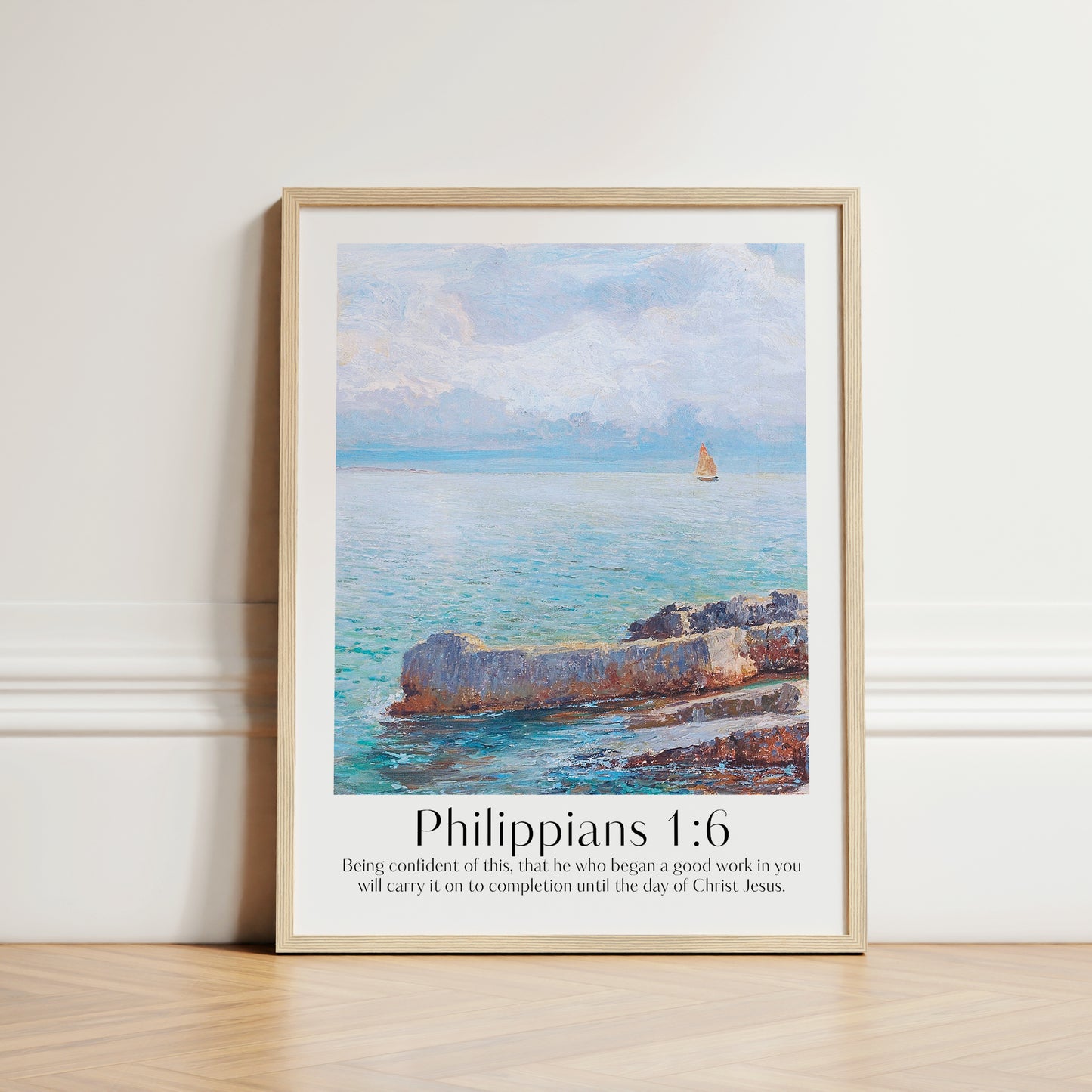 Framed Christian wall art print featuring a serene coastal scene inspired by Menci Clement. The artwork depicts a tranquil ocean view with a distant sailboat, paired with the Bible verse Philippians 1:6: "Being confident of this, that he who began a good work in you will carry it on to completion until the day of Christ Jesus." This piece beautifully combines peaceful scenery with spiritual encouragement, making it a thoughtful addition to any home or prayer space.