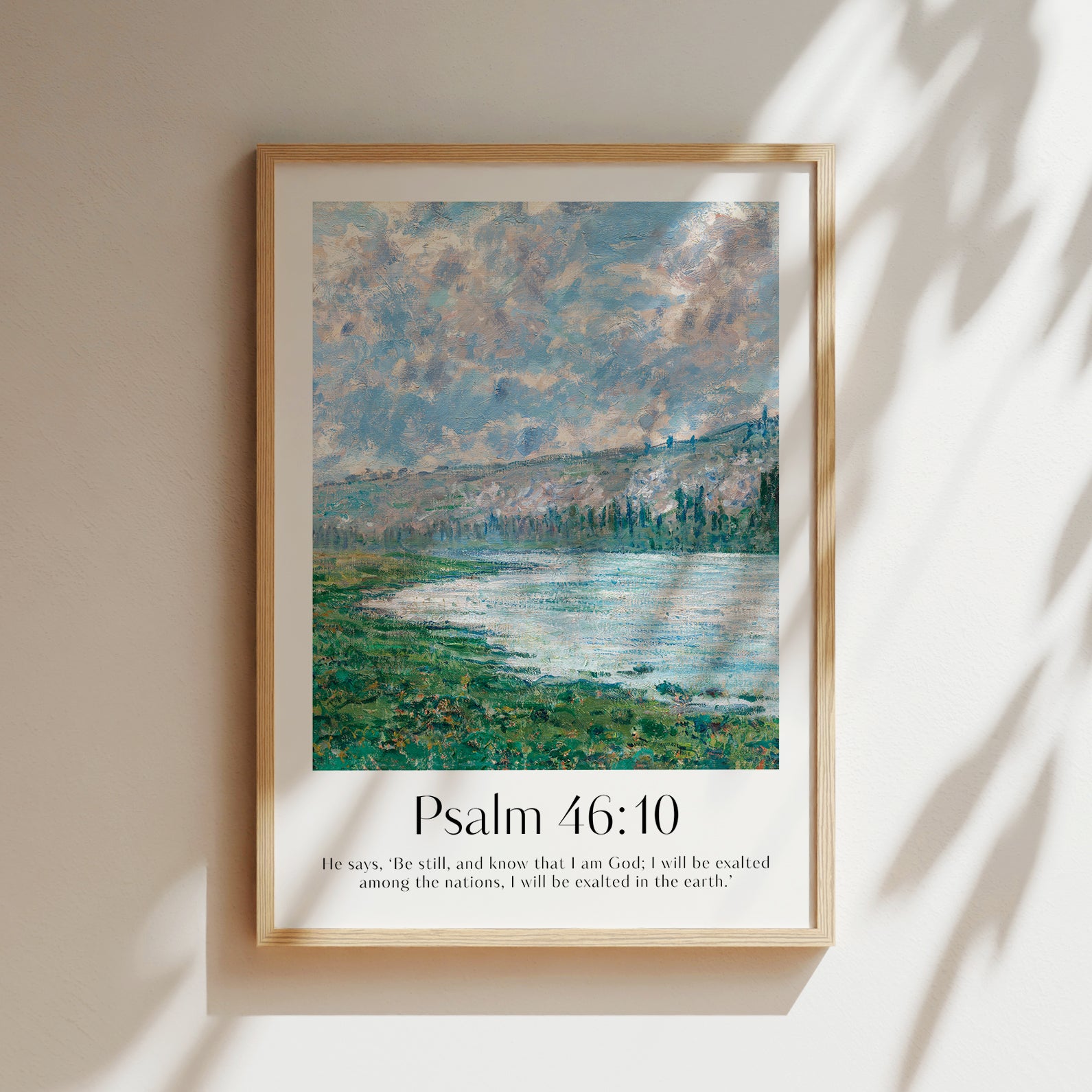 Vintage-style framed wall art showcasing a Monet painting of a landscape with the ‘Be Still’ bible verse for Christian Home Decor