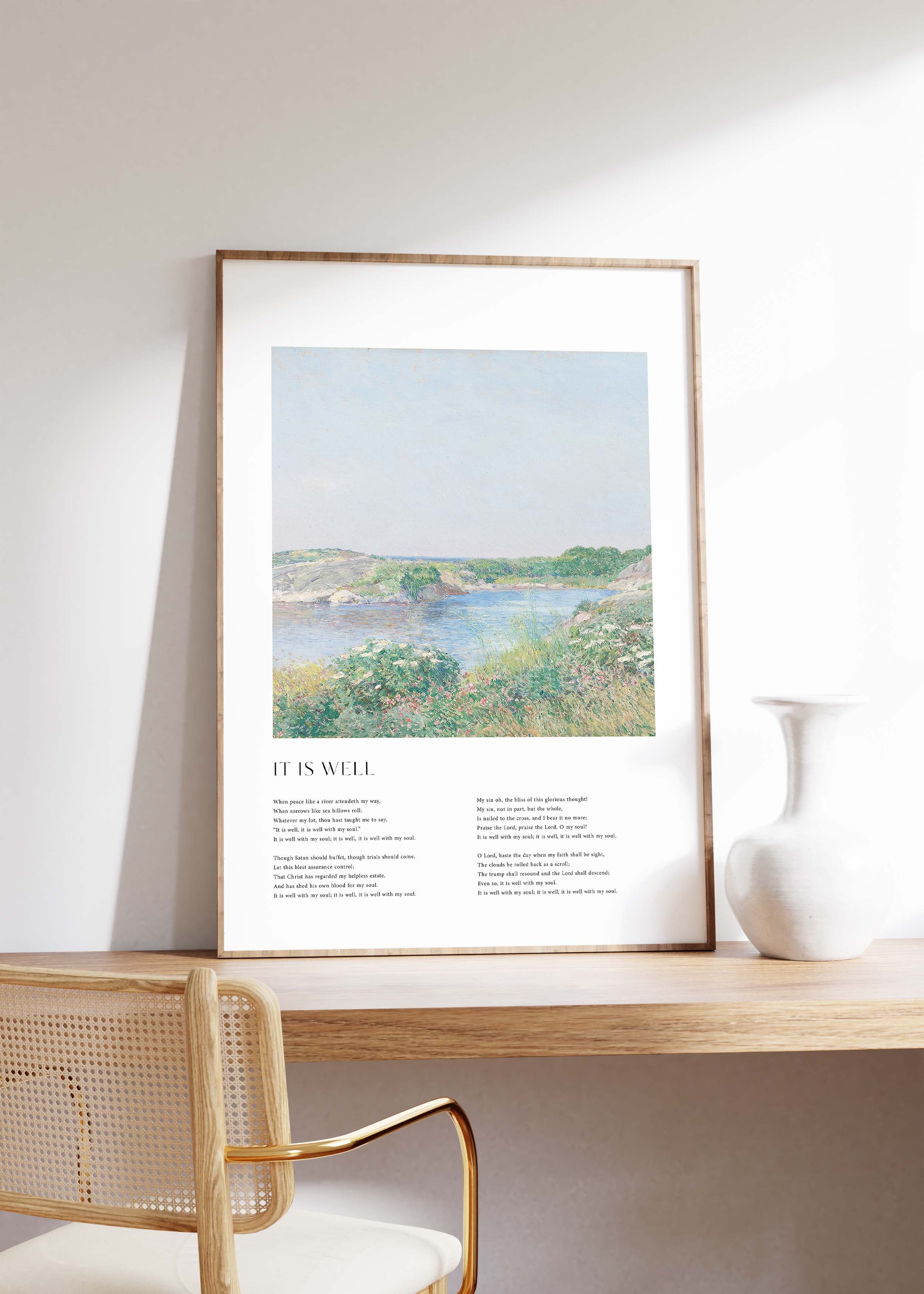 Framed Christian wall art print featuring a serene riverside landscape in a vintage style. The artwork is paired with the lyrics of the hymn "It Is Well," offering words of peace and comfort. This piece combines tranquil scenery with spiritual reflection, making it a beautiful addition to any home or prayer space.