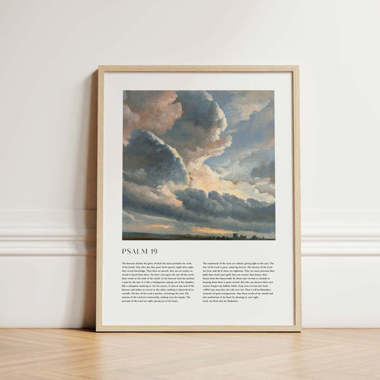Framed Christian wall art print featuring a dramatic sky landscape in a vintage style. The artwork displays towering, illuminated clouds over a serene horizon, paired with the full text of Psalm 19. This piece combines the majesty of the natural world with spiritual reflection, making it an inspiring addition to any home or place of worship.