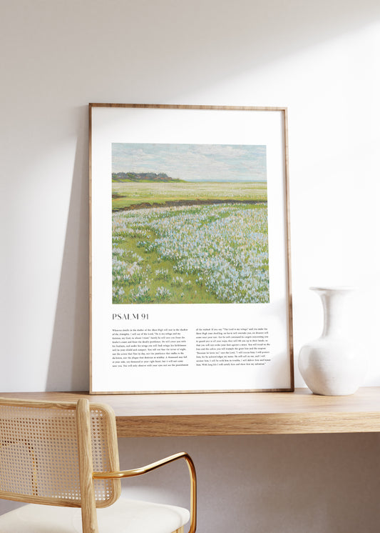 Framed Christian wall art print featuring a tranquil landscape in a vintage style. The artwork displays a peaceful field of flowers under a bright sky, paired with the full text of Psalm 91. This piece combines the beauty of nature with spiritual reflection, making it a comforting addition to any home or prayer space.