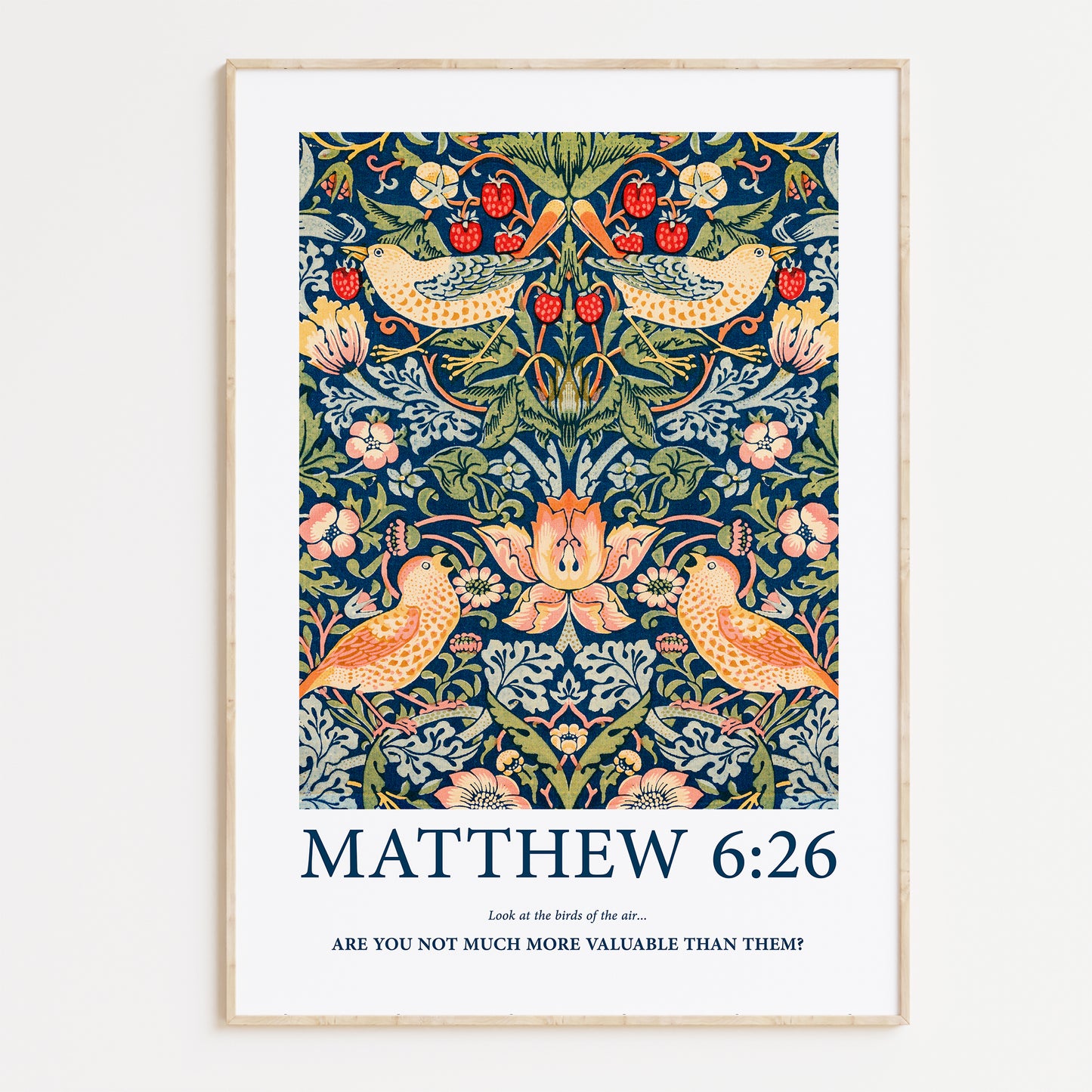 Framed Christian wall art print featuring a detailed floral and bird pattern inspired by William Morris. Displays the Bible verse Matthew 6:26: "Look at the birds of the air... Are you not much more valuable than them?" This artwork blends classic, nature-inspired design with a powerful scripture, making it a meaningful addition to any Christian home. Elegantly framed in light wood, perfect for enhancing living room or prayer space decor.