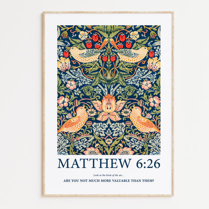 Framed Christian wall art print featuring a detailed floral and bird pattern inspired by William Morris. Displays the Bible verse Matthew 6:26: "Look at the birds of the air... Are you not much more valuable than them?" This artwork blends classic, nature-inspired design with a powerful scripture, making it a meaningful addition to any Christian home. Elegantly framed in light wood, perfect for enhancing living room or prayer space decor.