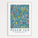 Framed Christian wall art print featuring a colorful fruit and floral pattern inspired by William Morris. Displays the Bible verse Psalm 34:8: "Taste and see that the Lord is good; blessed is the one who takes refuge in him." This artwork blends classic, nature-inspired design with a reassuring scripture, making it a vibrant addition to any Christian home. Elegantly framed in light wood, perfect for enhancing living room or kitchen decor.